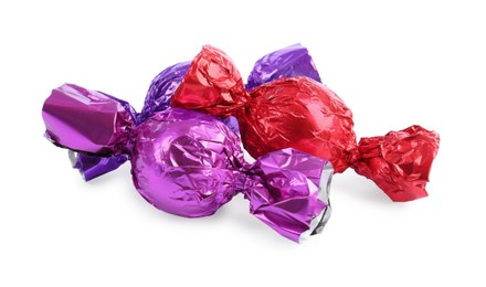Photo of Tasty candies in colorful wrappers isolated on white