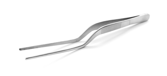 Photo of Stainless forceps on white background. Medical tool