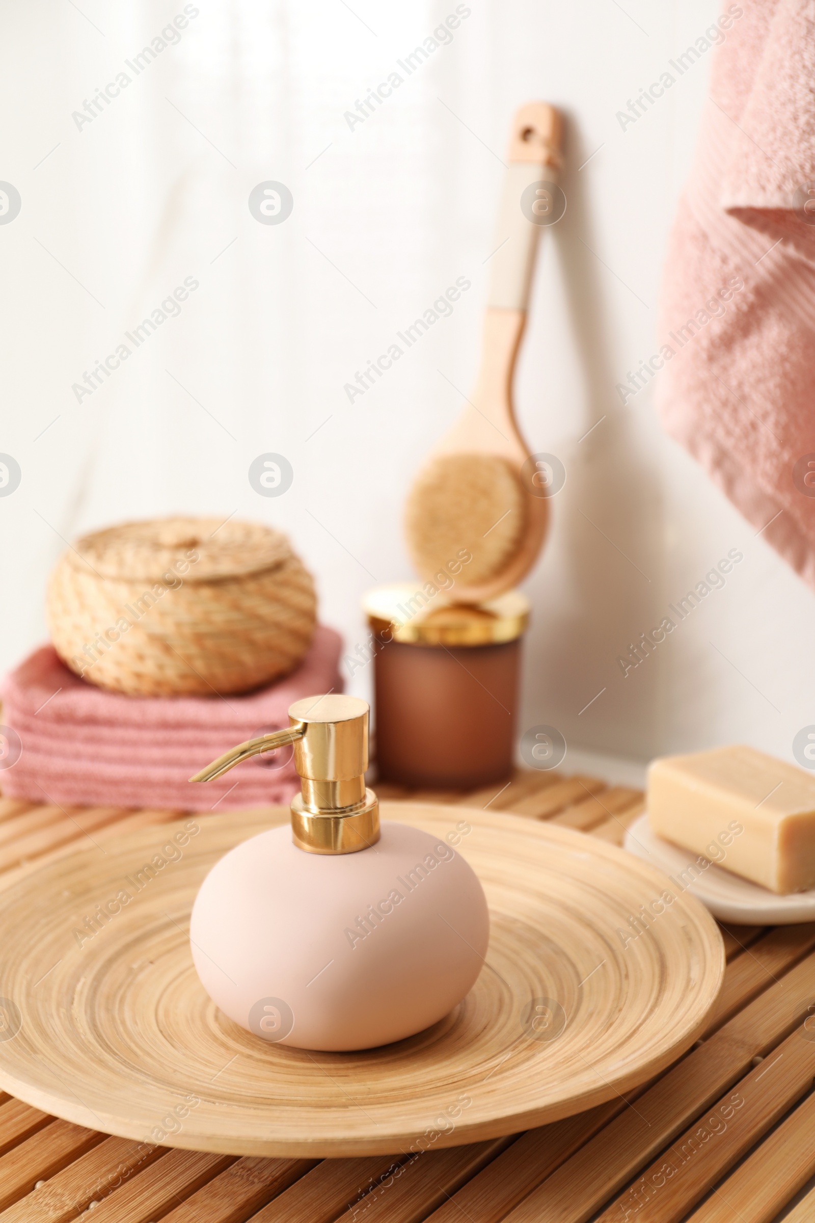 Photo of Different toiletries on wooden table in bathroom