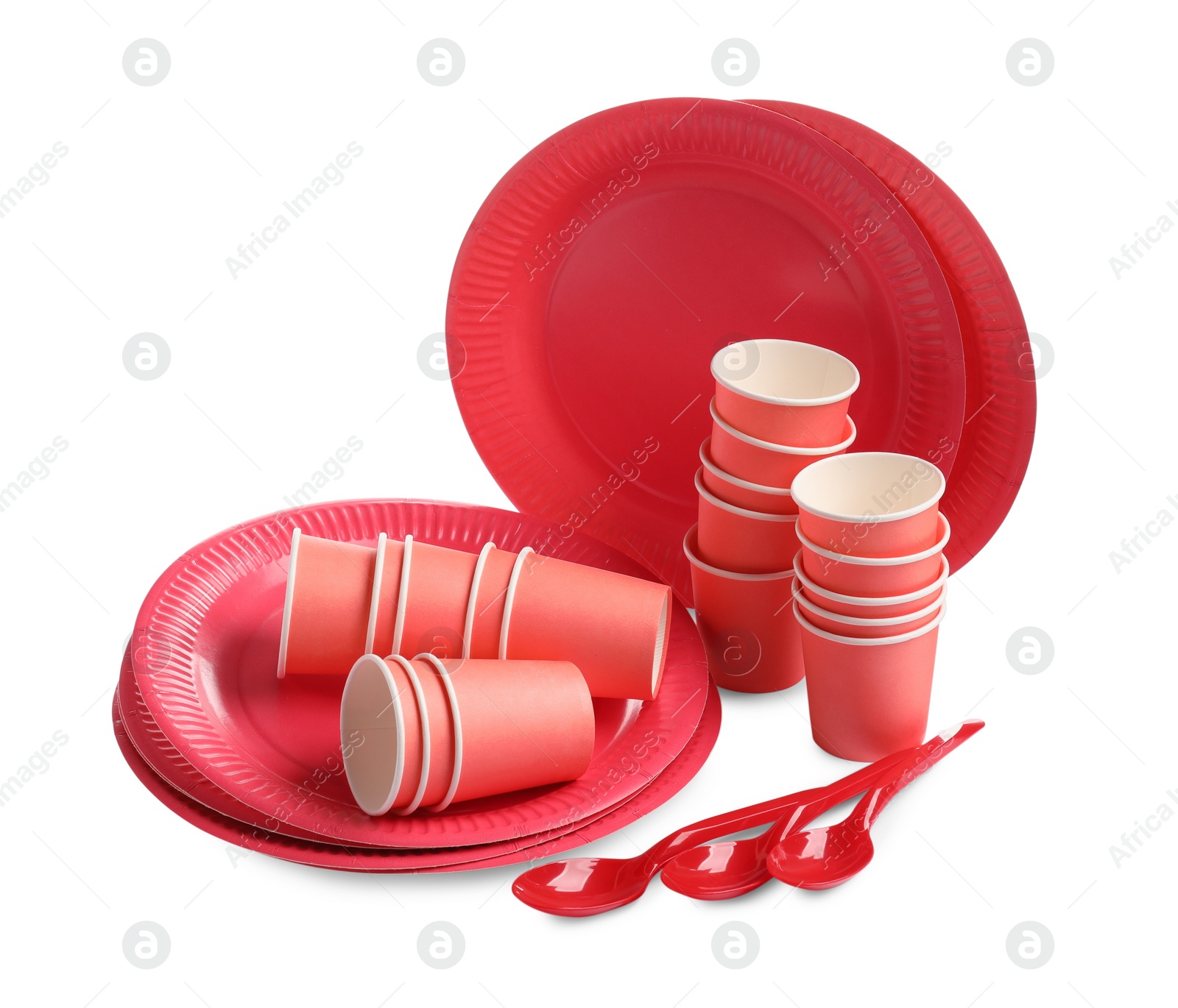 Photo of Set of bright disposable tableware on white background