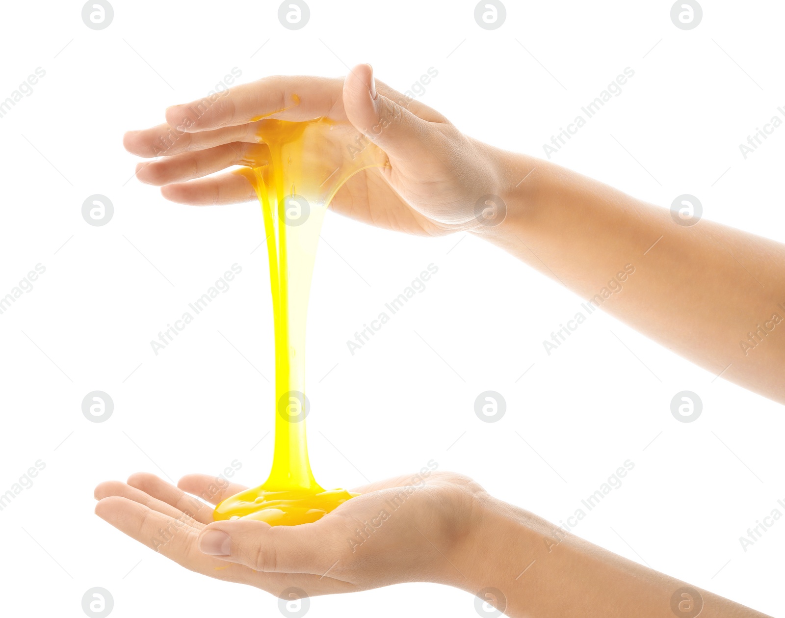 Photo of Woman playing with yellow slime isolated on white, closeup. Antistress toy