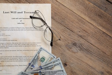 Photo of Last Will and Testament, dollar bills and glasses on wooden table, flat lay. Space for text