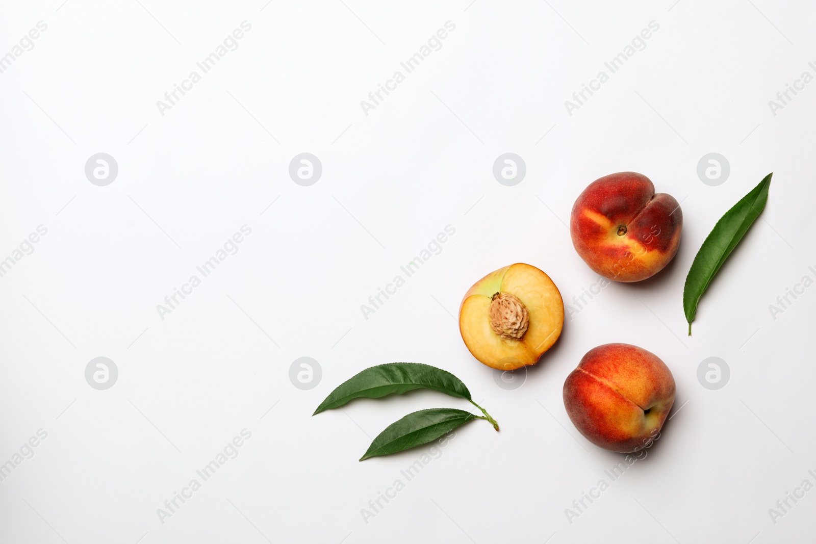 Photo of Flat lay composition with sweet juicy peaches on light background. Space for text