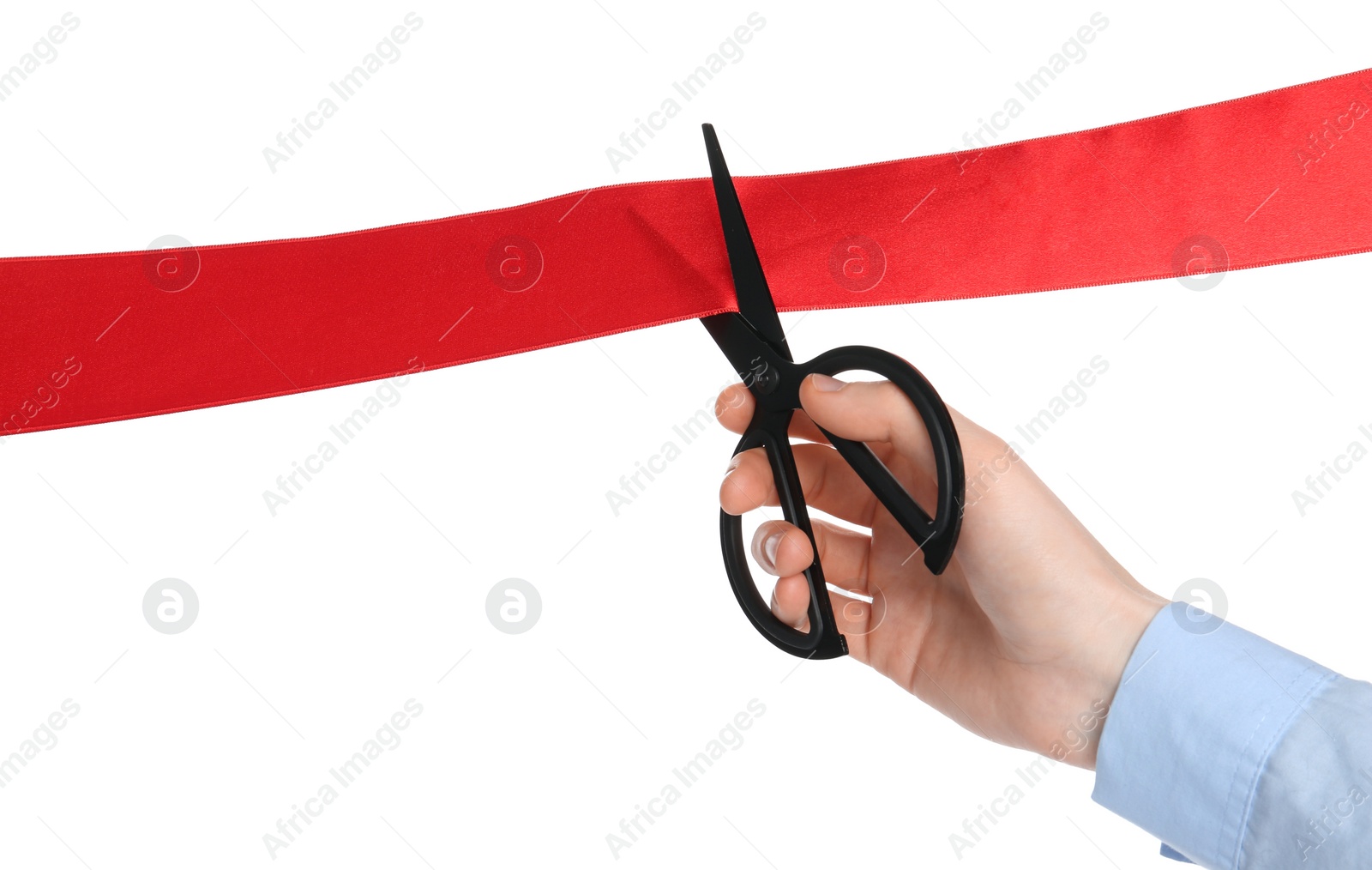 Photo of Man cutting red ribbon on white background, closeup