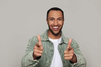 Photo of Portrait of smiling African American man on light grey background