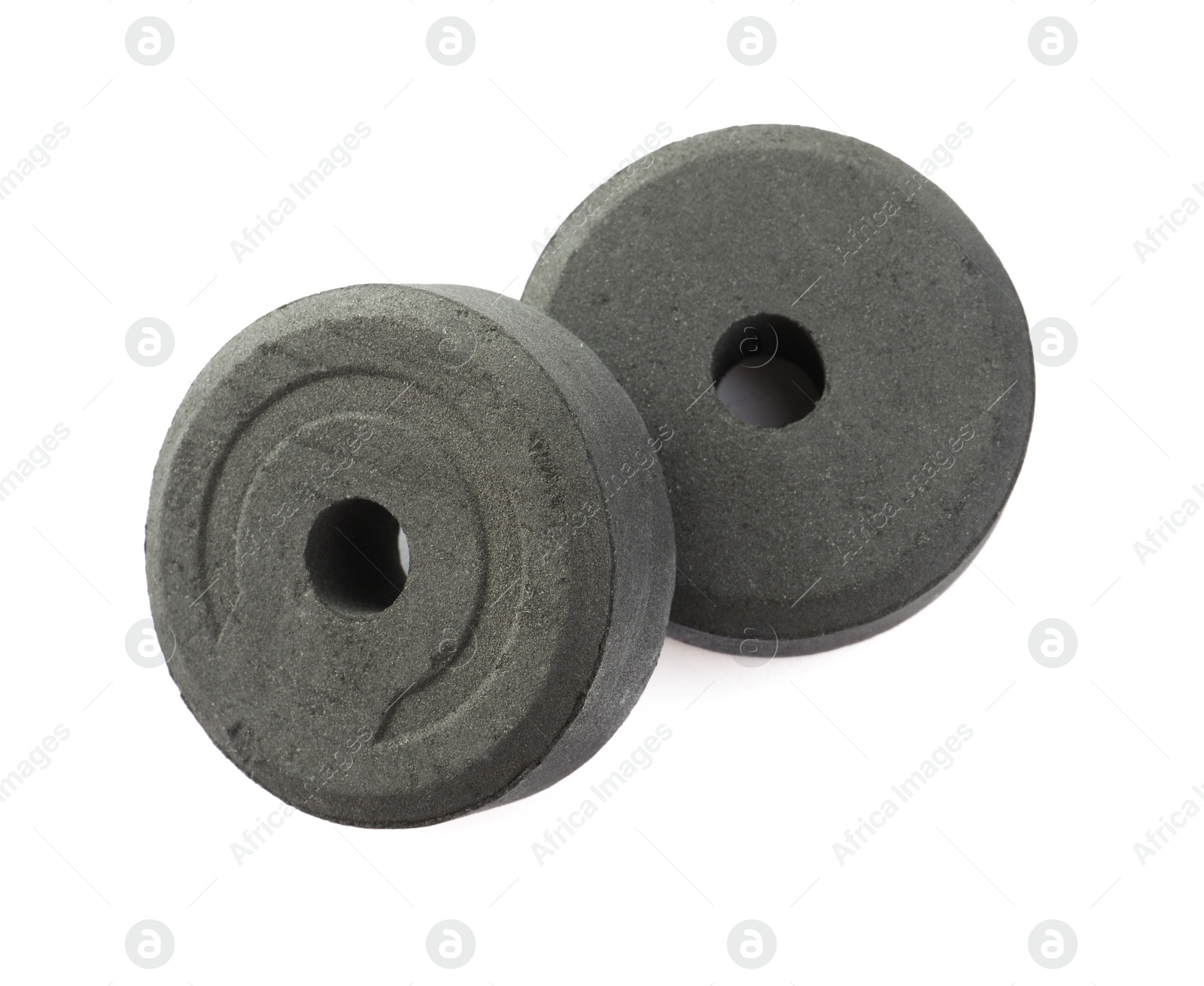 Photo of Charcoal rings for hookah on white background, top view