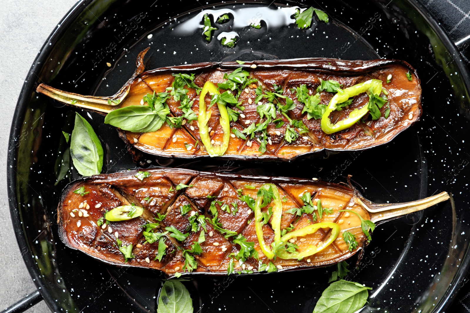 Photo of Frying pan with fried eggplant slices, closeup