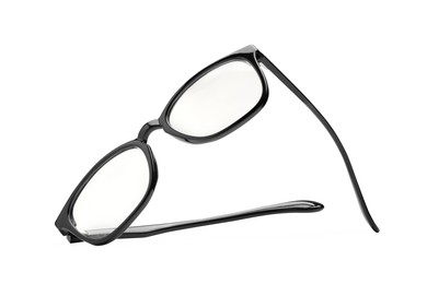 Photo of Stylish pair of glasses with black frame isolated on white