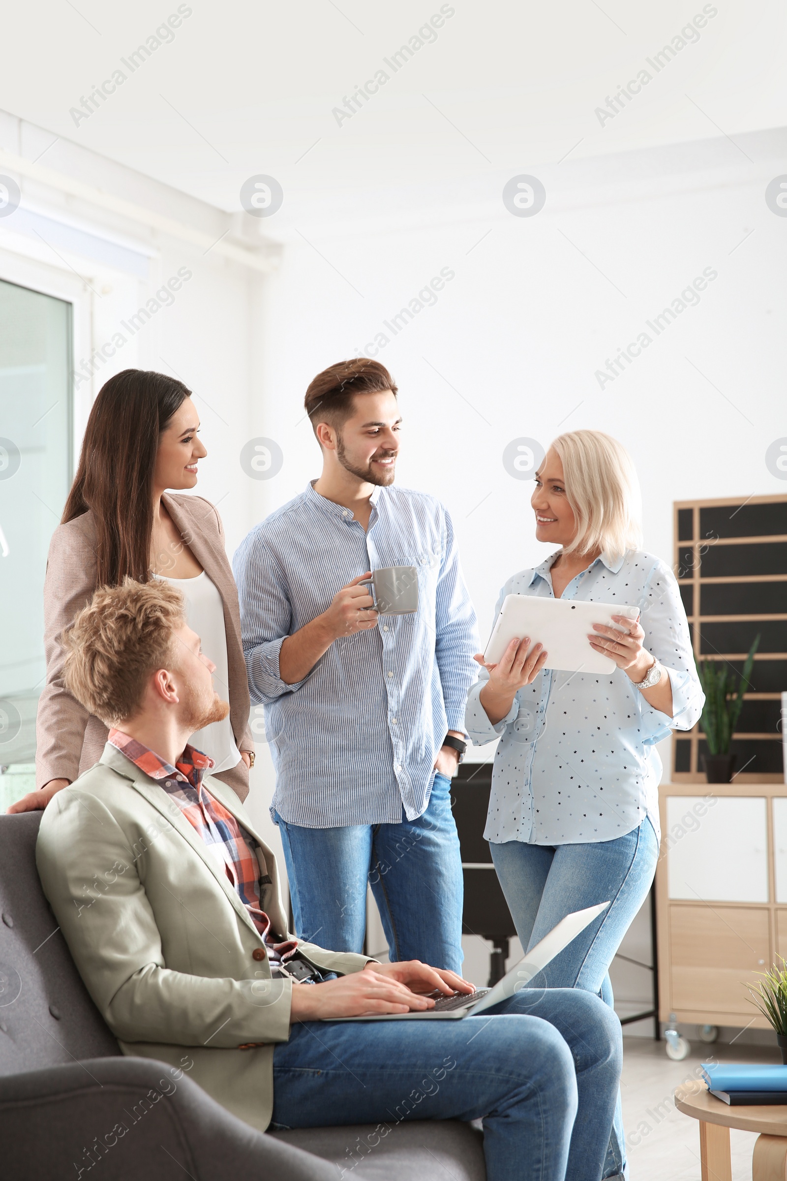 Photo of Business people discussing work matters in office. Professional communication