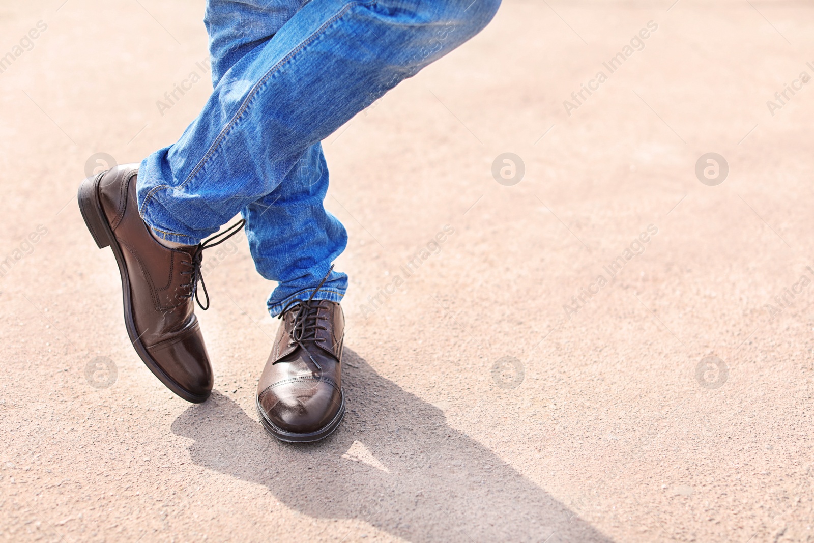 Photo of Man in elegant leather shoes outdoors, closeup