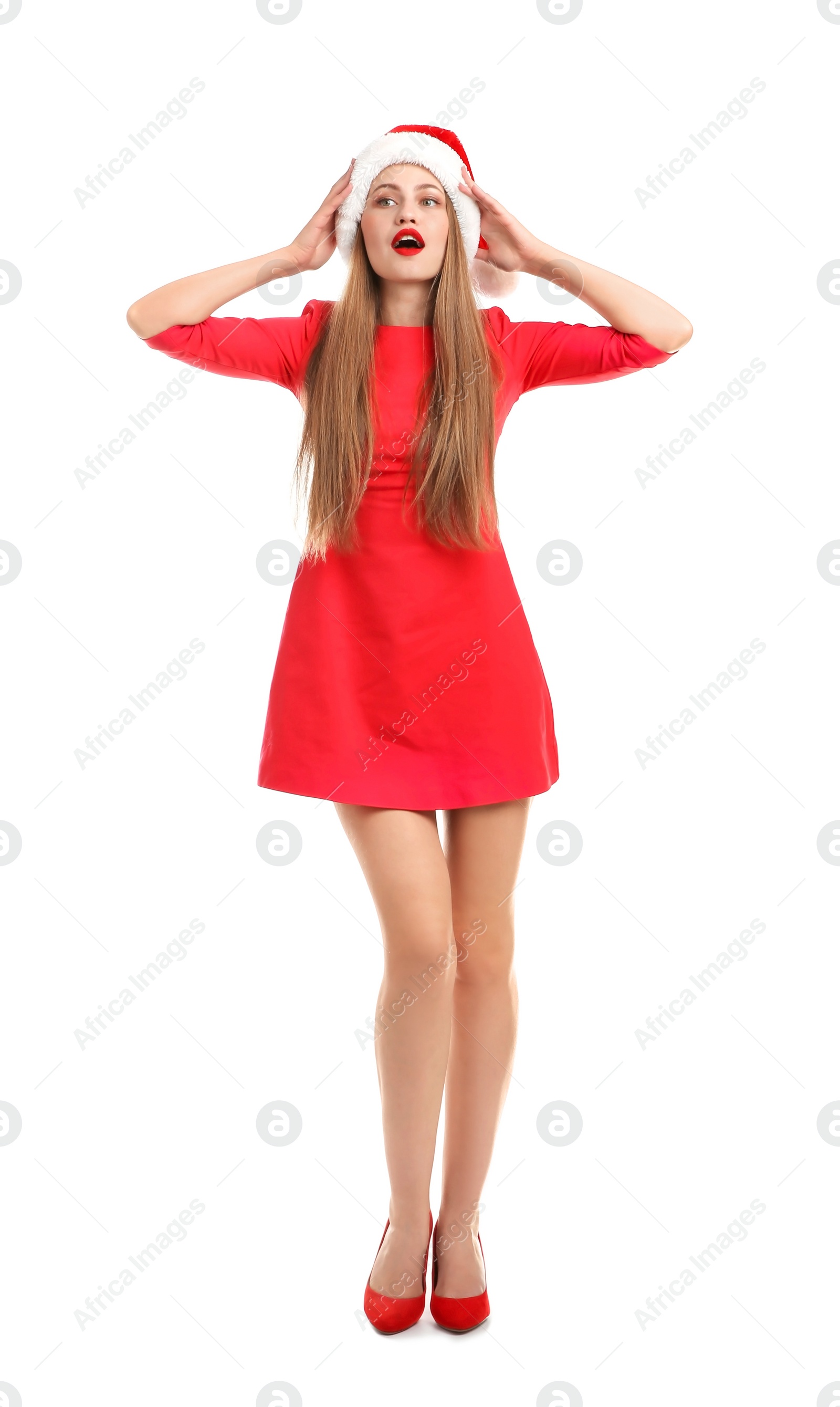 Photo of Young beautiful woman in Santa hat on white background. Christmas celebration