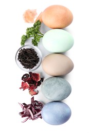 Photo of Naturally painted Easter eggs on white background, top view. Onion, parsley, tea, hibiscus and red cabbage used for coloring