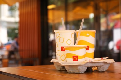 MYKOLAIV, UKRAINE - AUGUST 11, 2021: Cold McDonald's drinks on table in cafe. Space for text