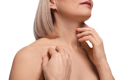 Woman touching her neck on white background, closeup