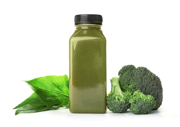 Photo of Bottle with healthy detox smoothie and ingredients on white background