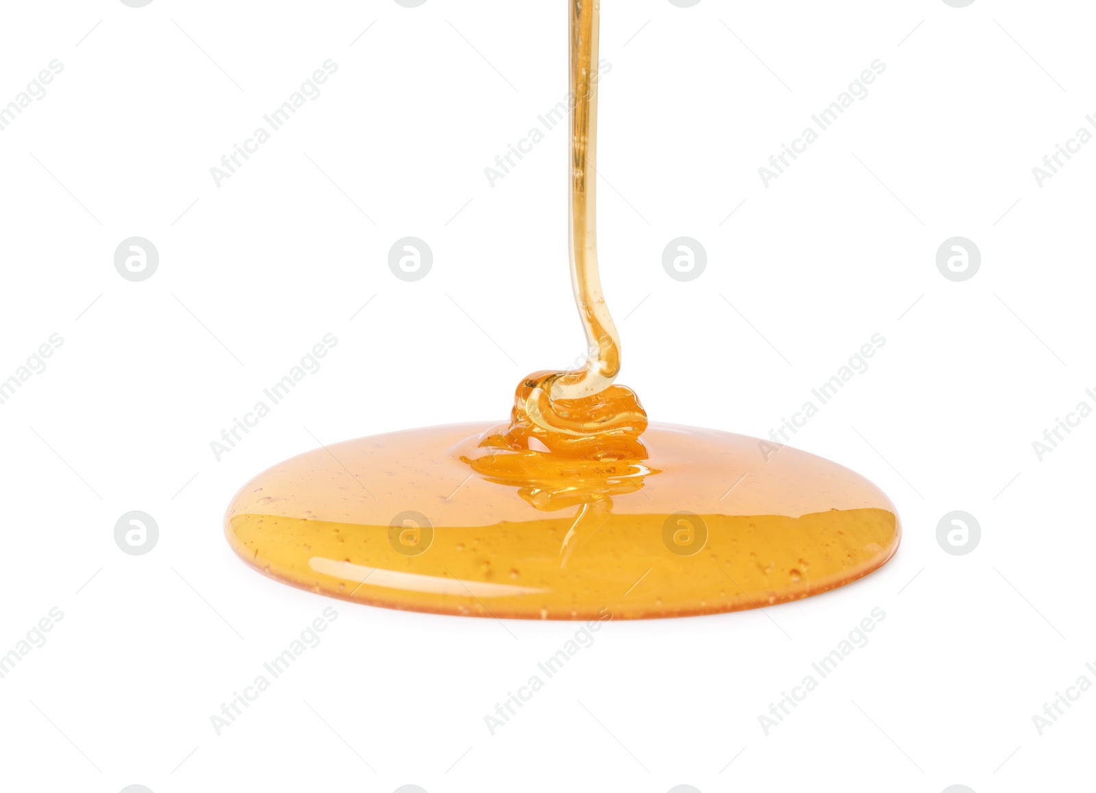 Photo of Pouring tasty natural honey isolated on white