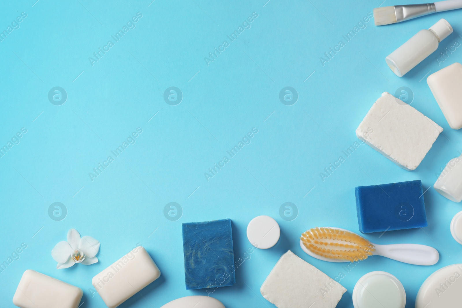 Photo of Flat lay composition with different soap bars on color background. Space for text