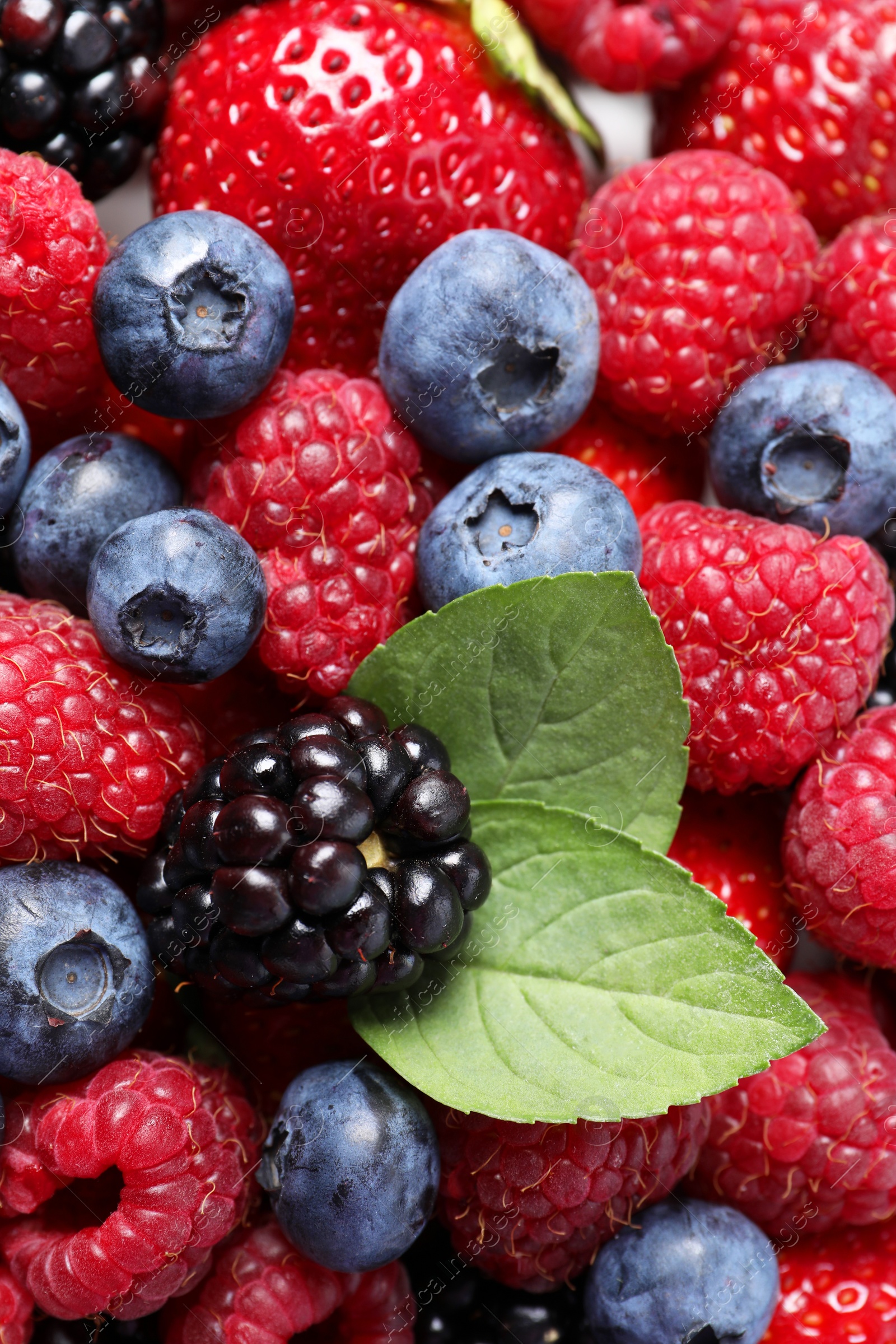 Photo of Different fresh ripe berries as background, closeup view