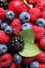 Different fresh ripe berries as background, closeup view