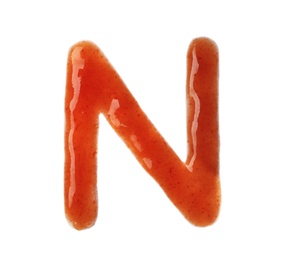 Photo of Letter N written with red sauce on white background