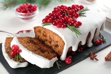 Photo of Traditional Christmas cake on white wooden table, closeup. Classic recipe