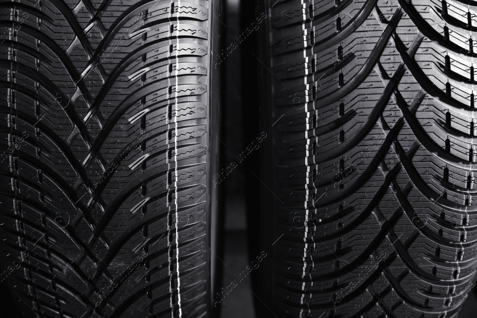 Photo of Car tires as background, closeup. Auto store