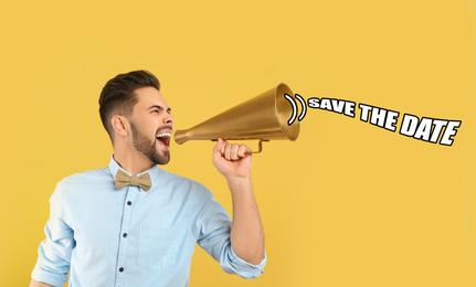 Image of Young man with megaphone and phrase SAVE THE DATE on yellow background