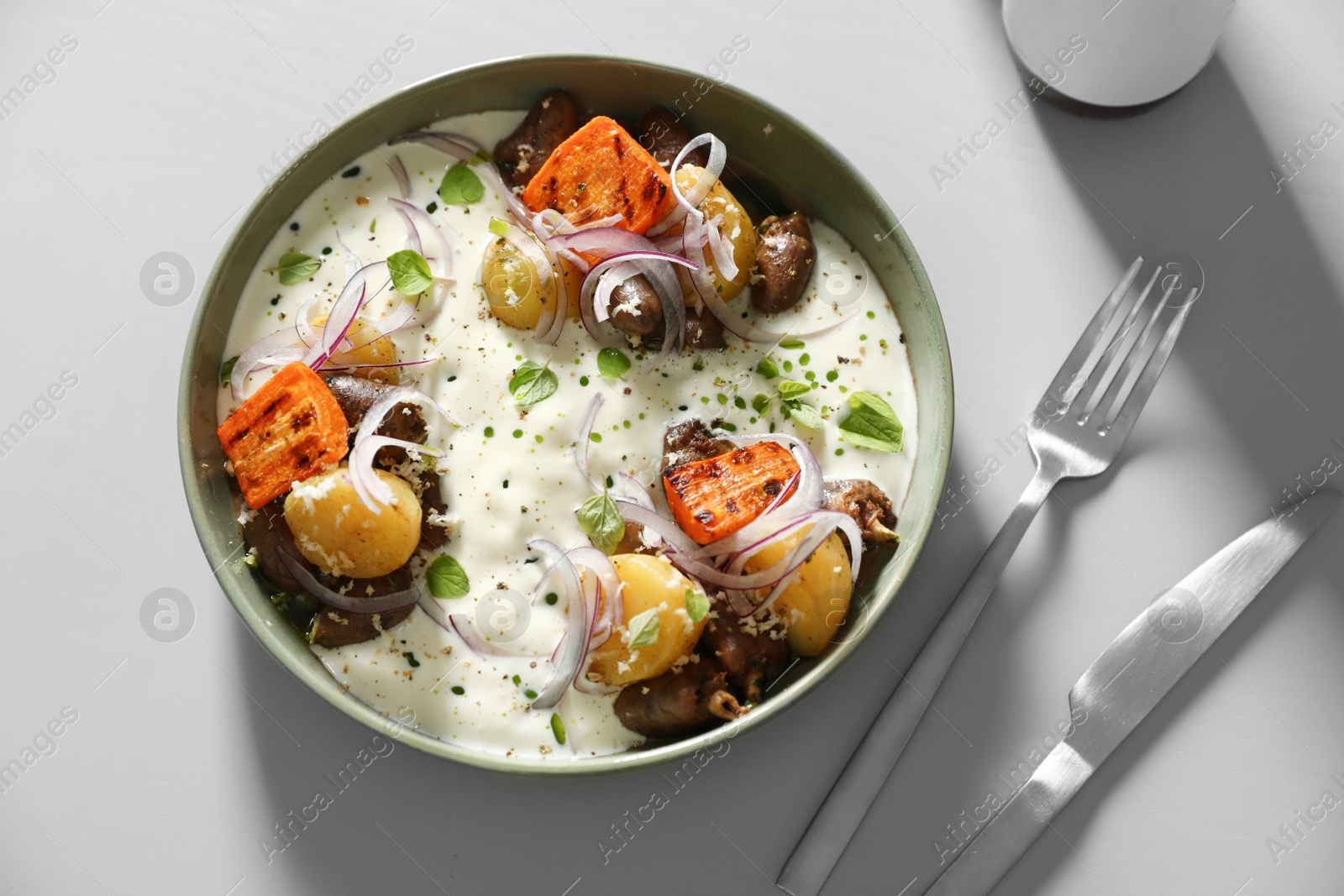 Photo of Tasty dish served on light table, flat lay