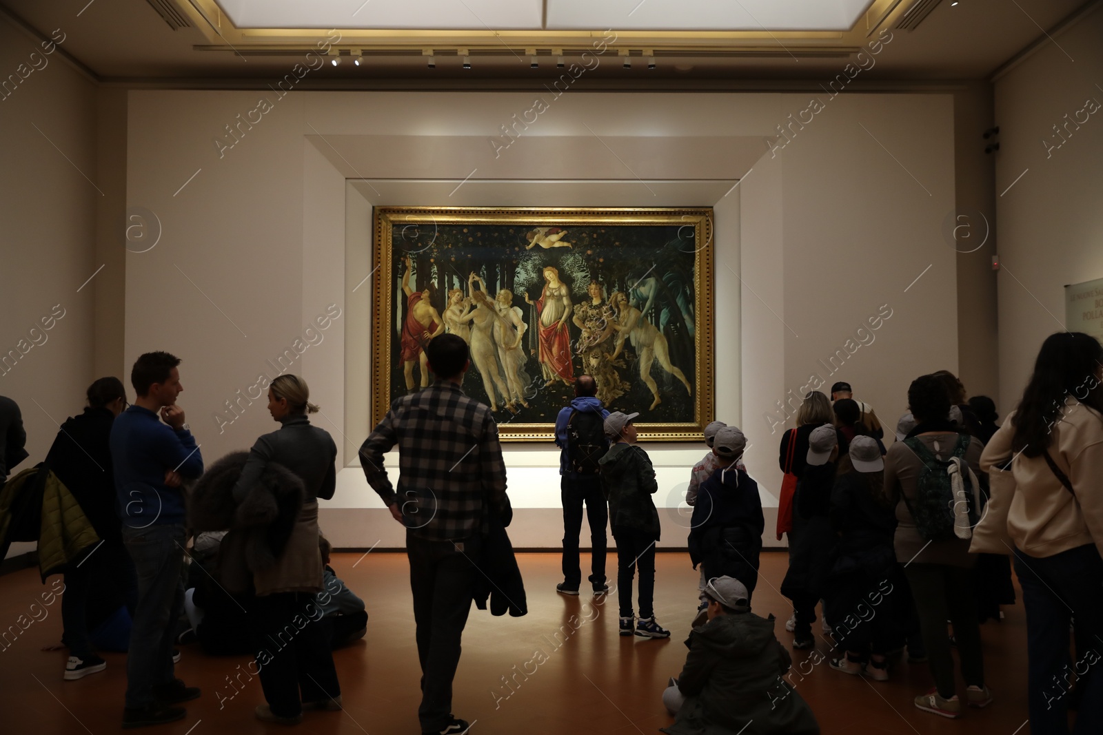 Photo of Florence, Italy - February 8, 2024: Visitors admiring painting "Primavera (Spring) " by Sandro Botticelli at Uffizi gallery