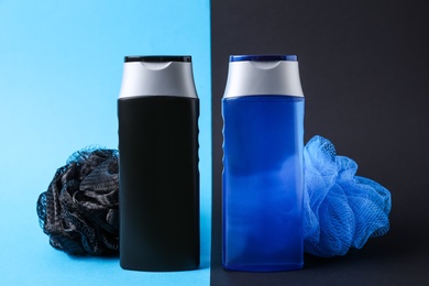 Photo of Bottles with shower gel and bast wisps on color background. Men's cosmetics