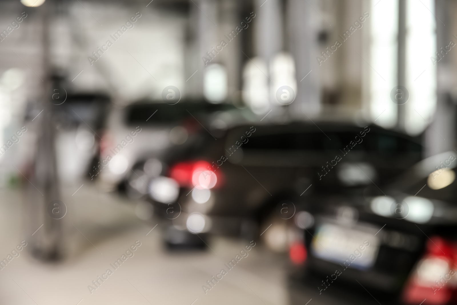 Photo of Blurred view of modern automobile repair shop