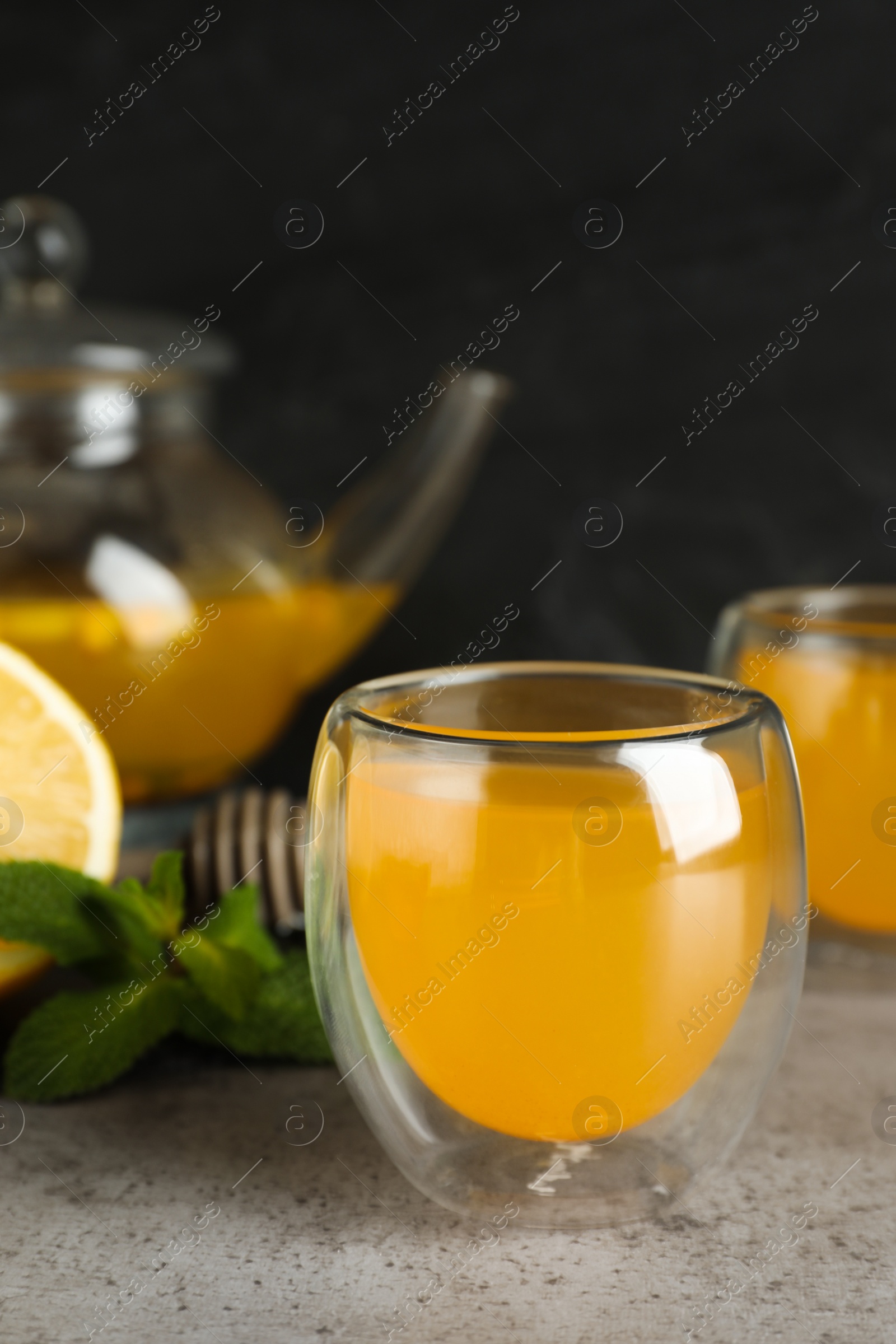 Photo of Immunity boosting drink and ingredients on light grey table