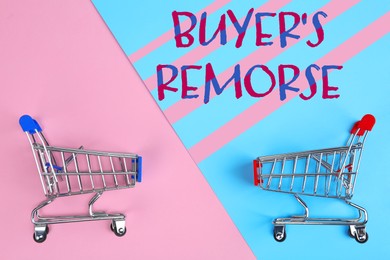 Text Buyer's Remorse and shopping carts on pink and light blue background, top view