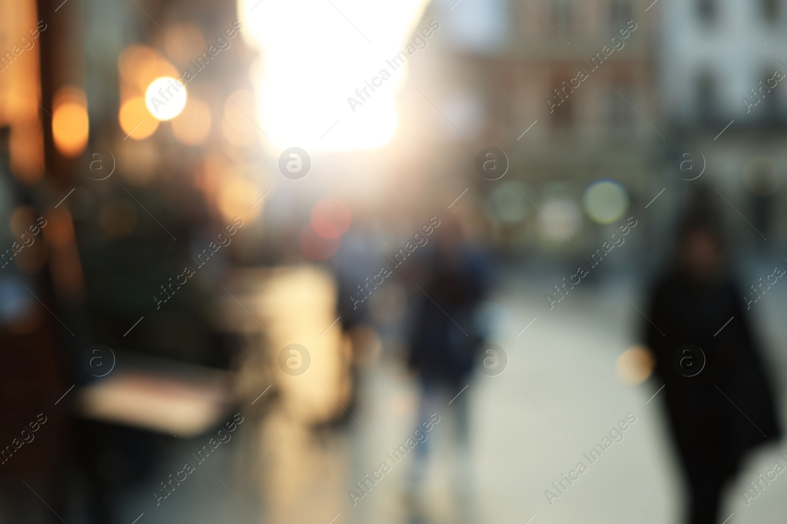 Photo of Blurred view of people walking on city street