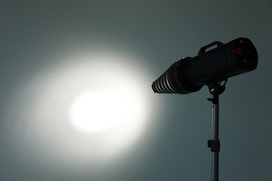 Photo of Studio lighting against gray background. Professional photo equipment