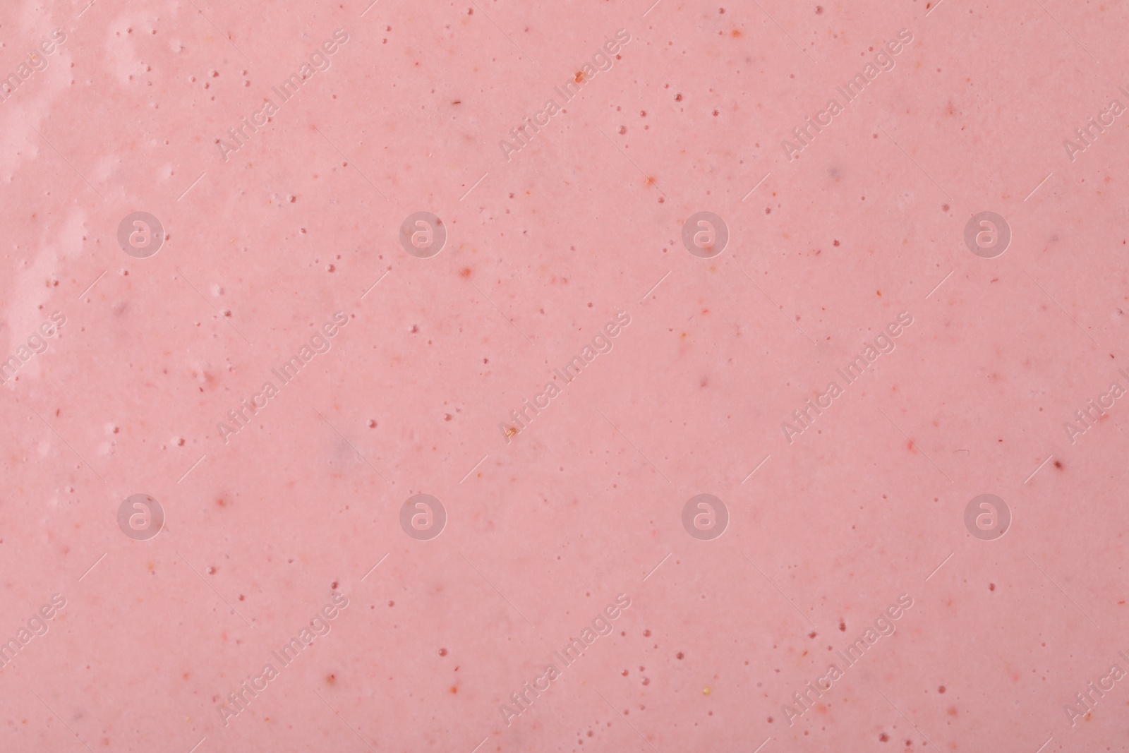 Photo of Tasty pink smoothie with bubbles as background, closeup