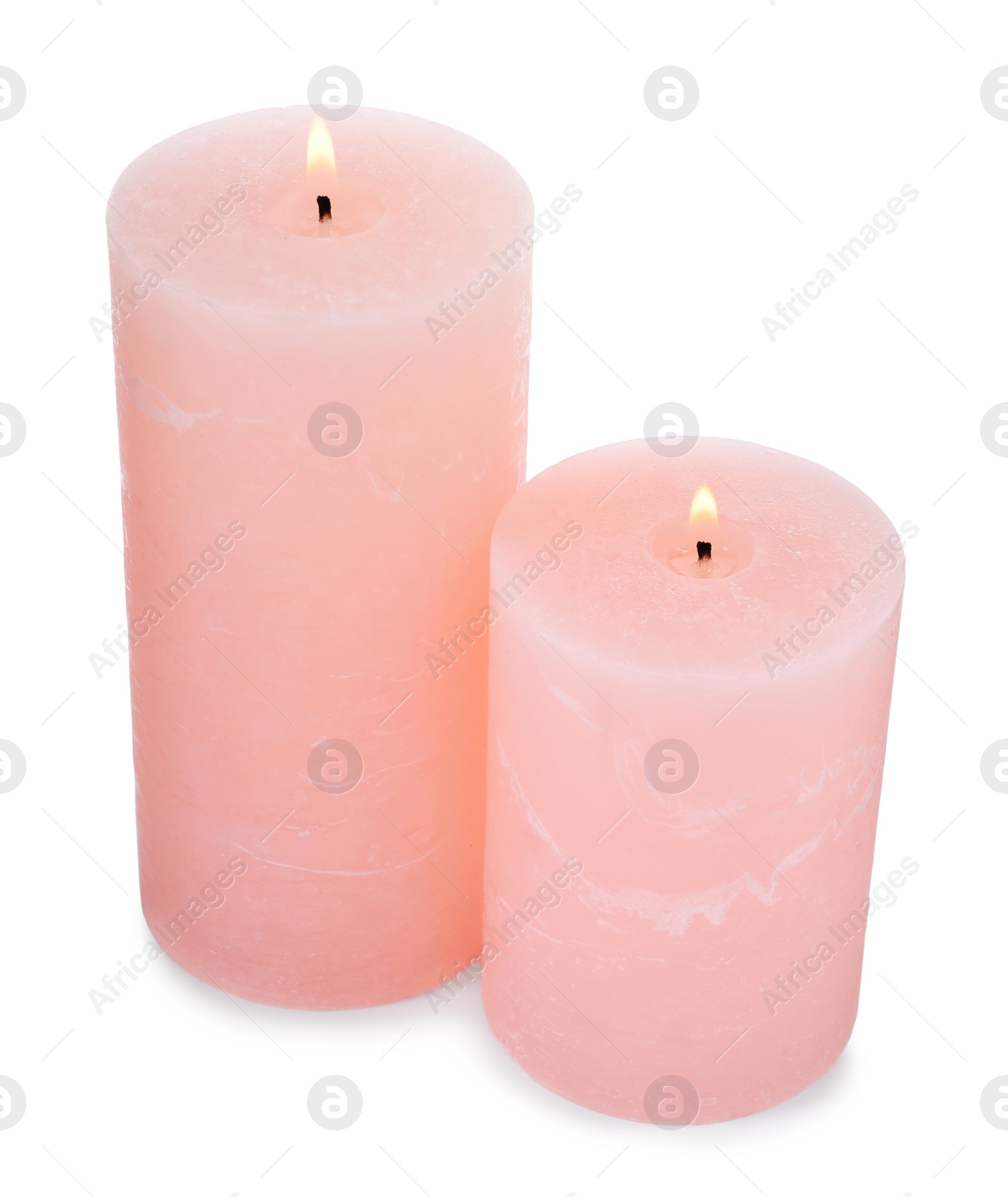 Photo of Burning pink wax candles on white background