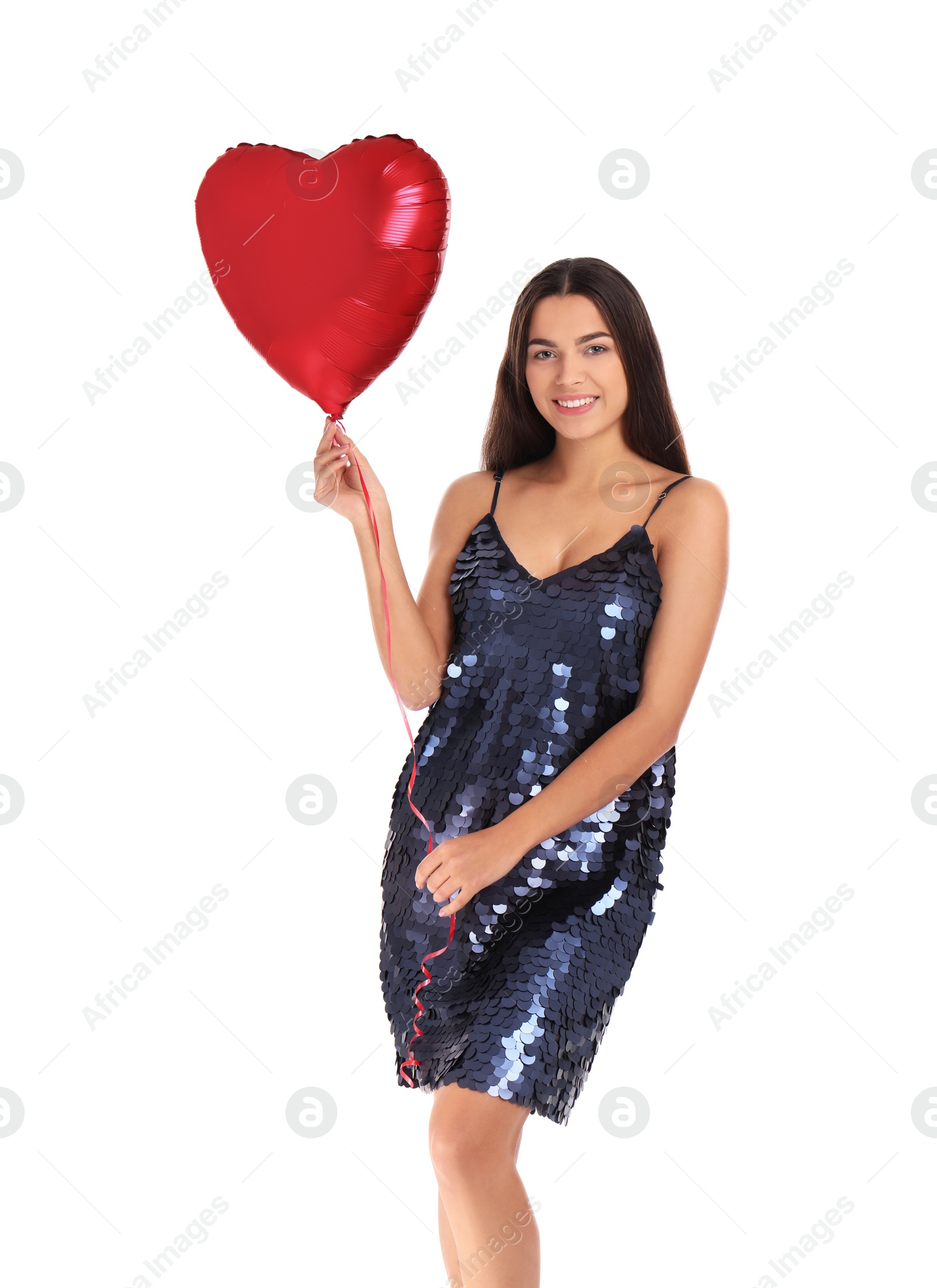 Photo of Portrait of young woman with heart shaped balloon on white background