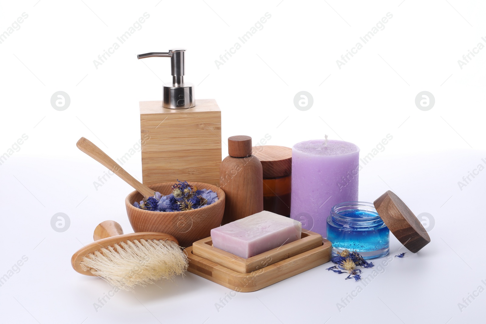 Photo of Composition with spa products, petals and candle isolated on white