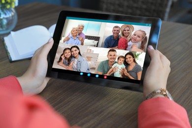 Image of Woman having online meeting with family members via videocall application indoors, closeup