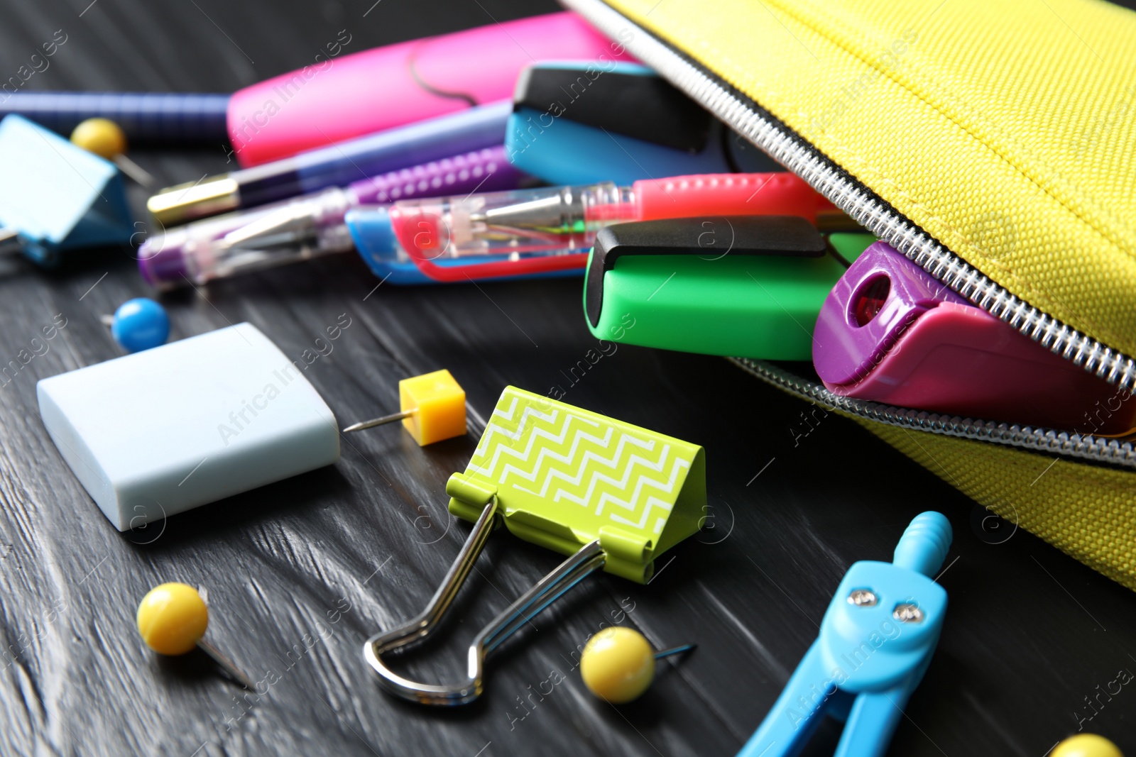 Photo of Different stationery on wooden table. Back to school