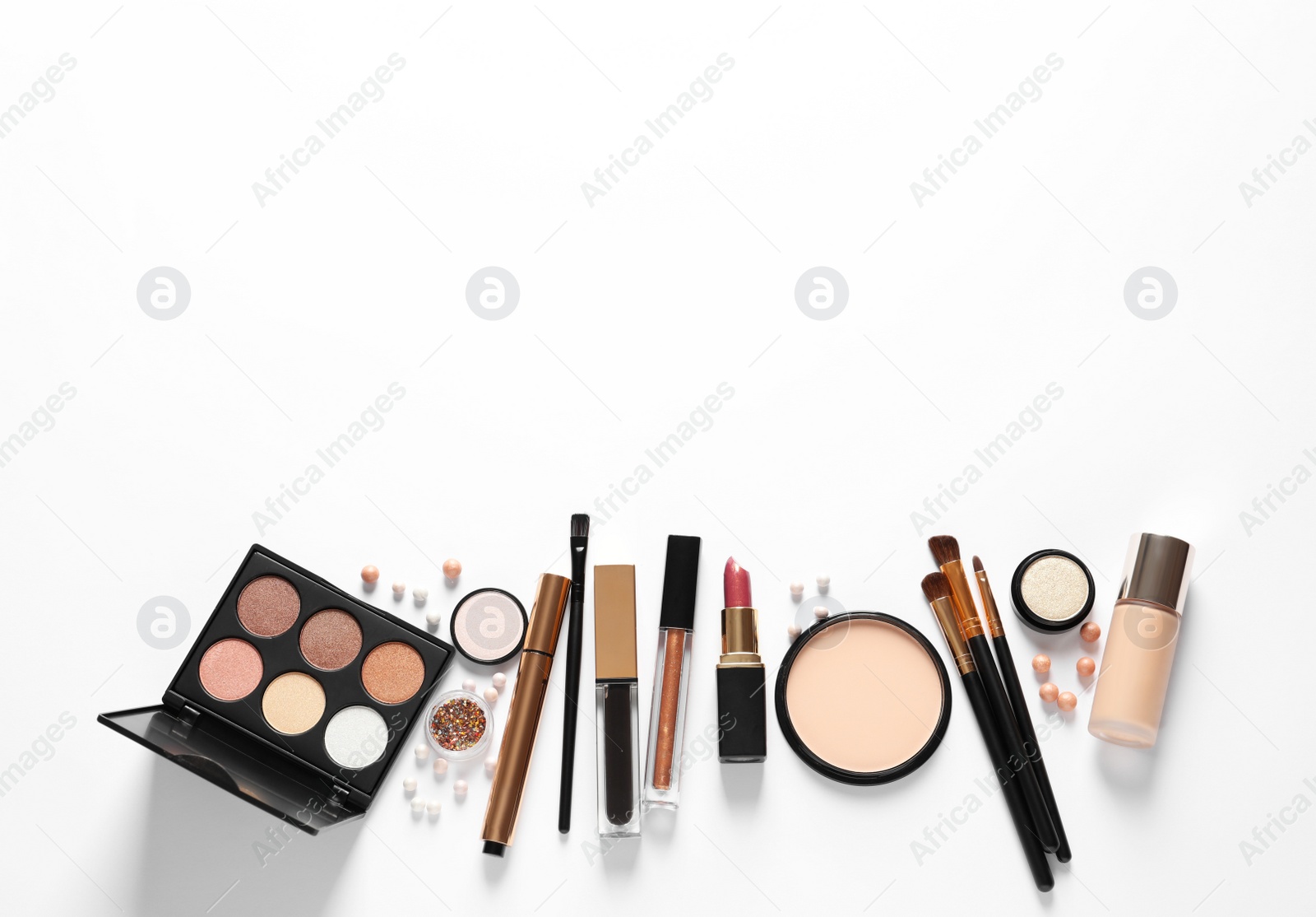 Photo of Different luxury makeup products on white background, top view