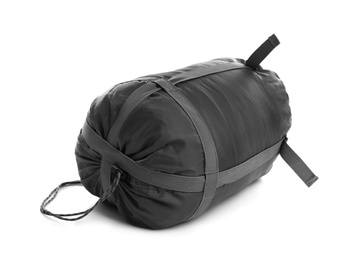 Photo of Sleeping bag in case on white background. Camping equipment