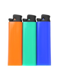 Stylish small pocket lighters on white background, top view