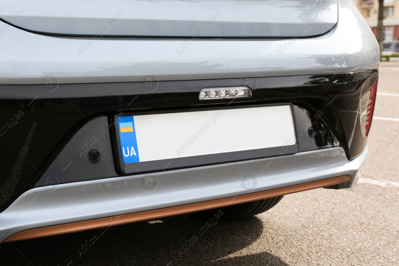 Photo of Car with vehicle registration plate outdoors, closeup