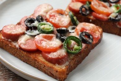 Tasty pizza toast on table, closeup view