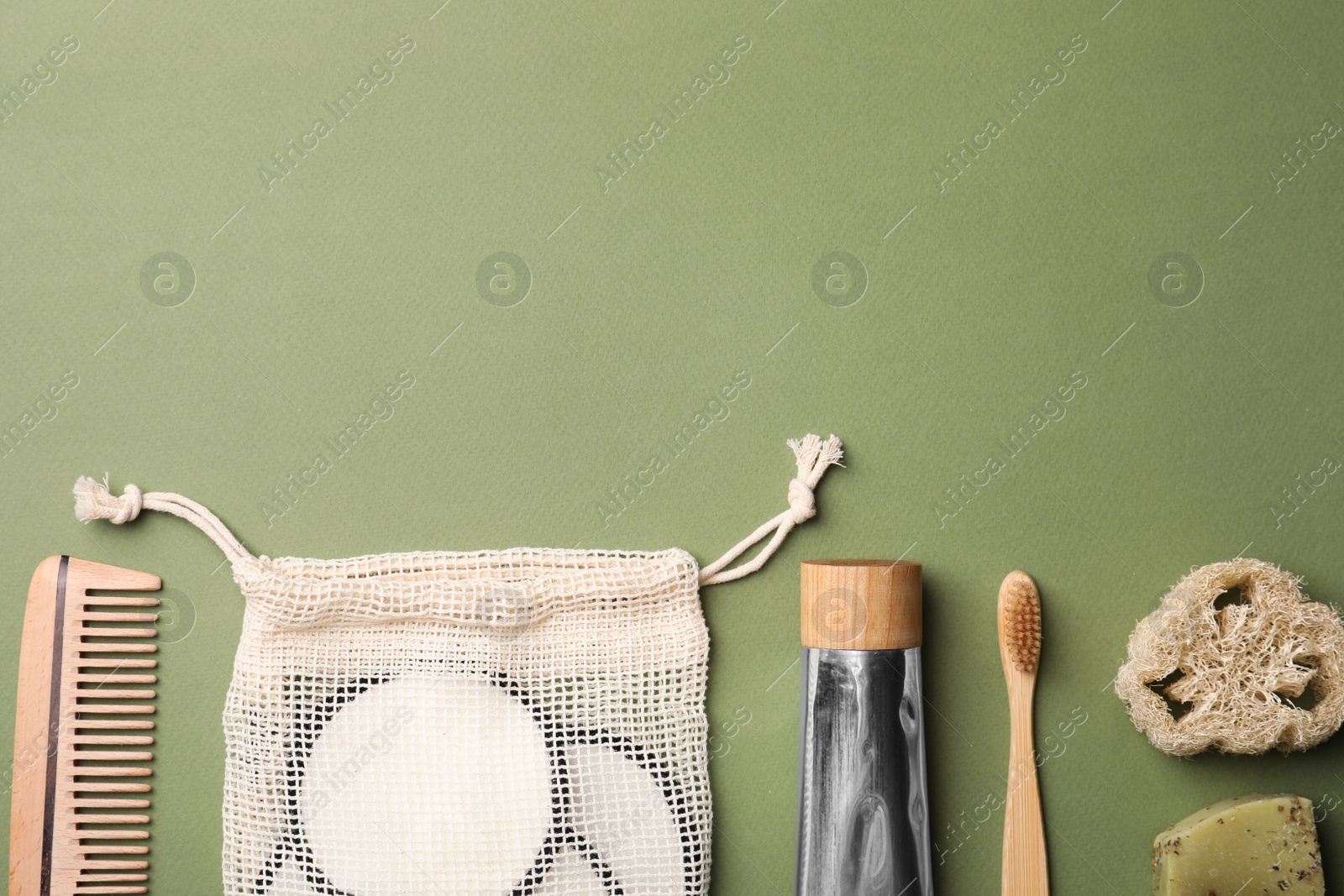 Photo of Flat lay composition with eco friendly products on green background, space for text. Conscious consumption