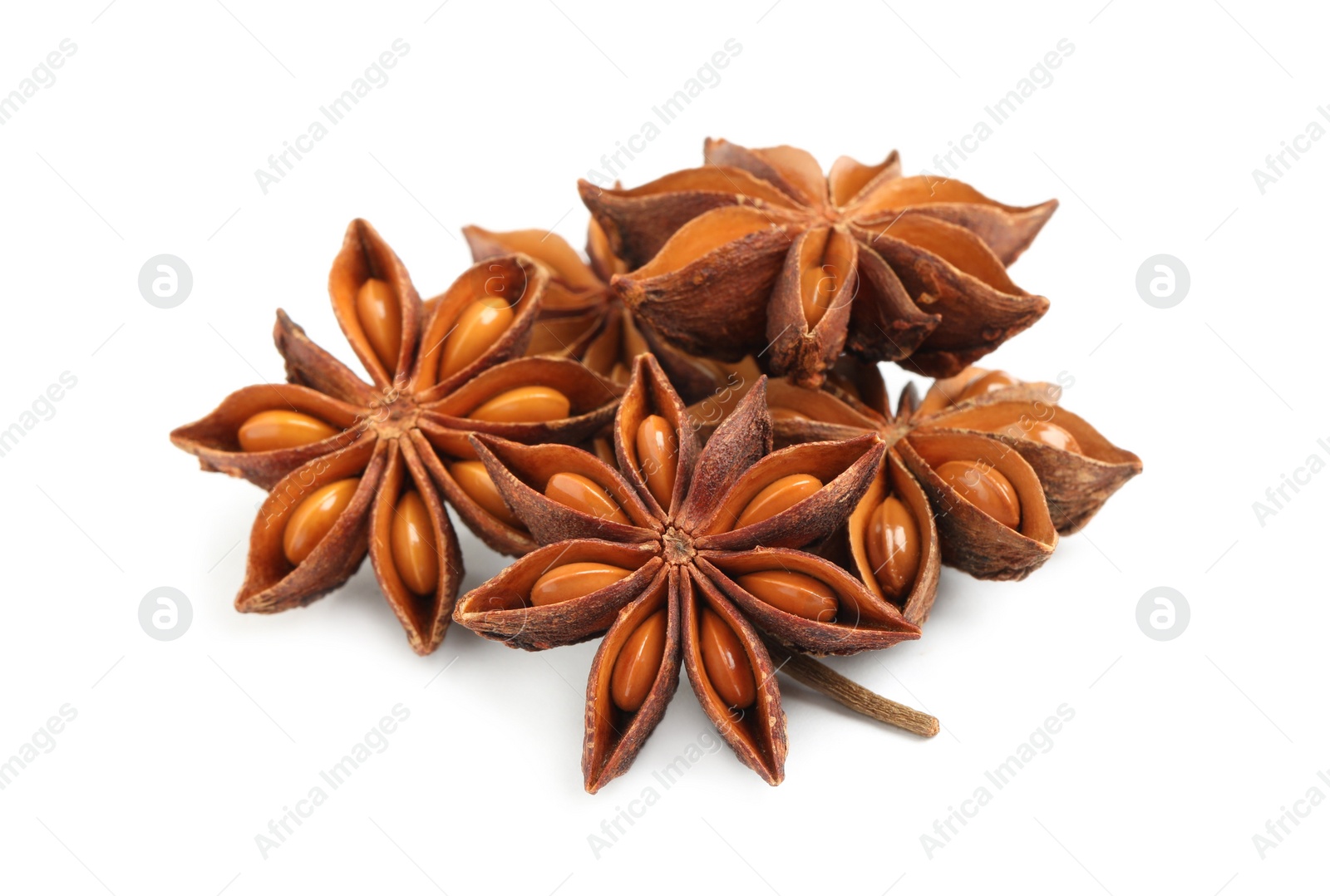 Photo of Dry anise stars with seeds on white background