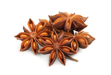 Photo of Dry anise stars with seeds on white background