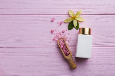 Photo of Flat lay composition with spa supplies on pink wooden table. Space for text